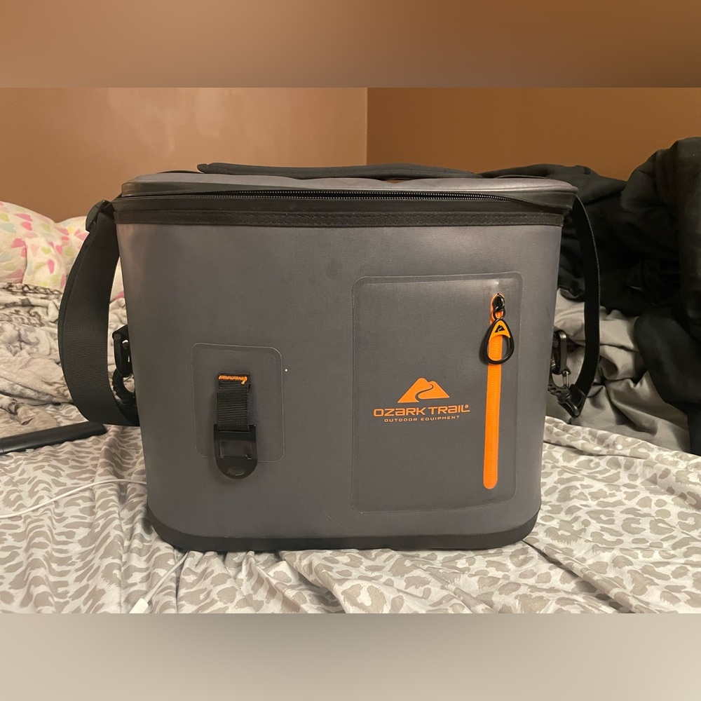 Ozark Trail cooler grey and orange with shoulder strap.